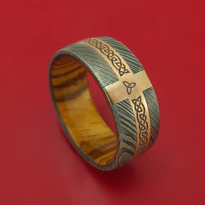 Lashbrook Rings Damascus Steel Ring with 14k Rose Gold and Etched Celtic Design Inlays and Interior Hardwood Sleeve Custom Made Band Lashbrook Rings Damascus Steel Ring with 14k Rose Gold and Etched Celtic Design Inlays and Interior Hardwood Sleeve Custom Made Band