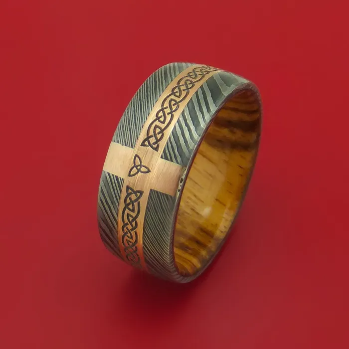 Lashbrook Rings Damascus Steel Ring with 14k Rose Gold and Etched Celtic Design Inlays and Interior Hardwood Sleeve Custom Made Band